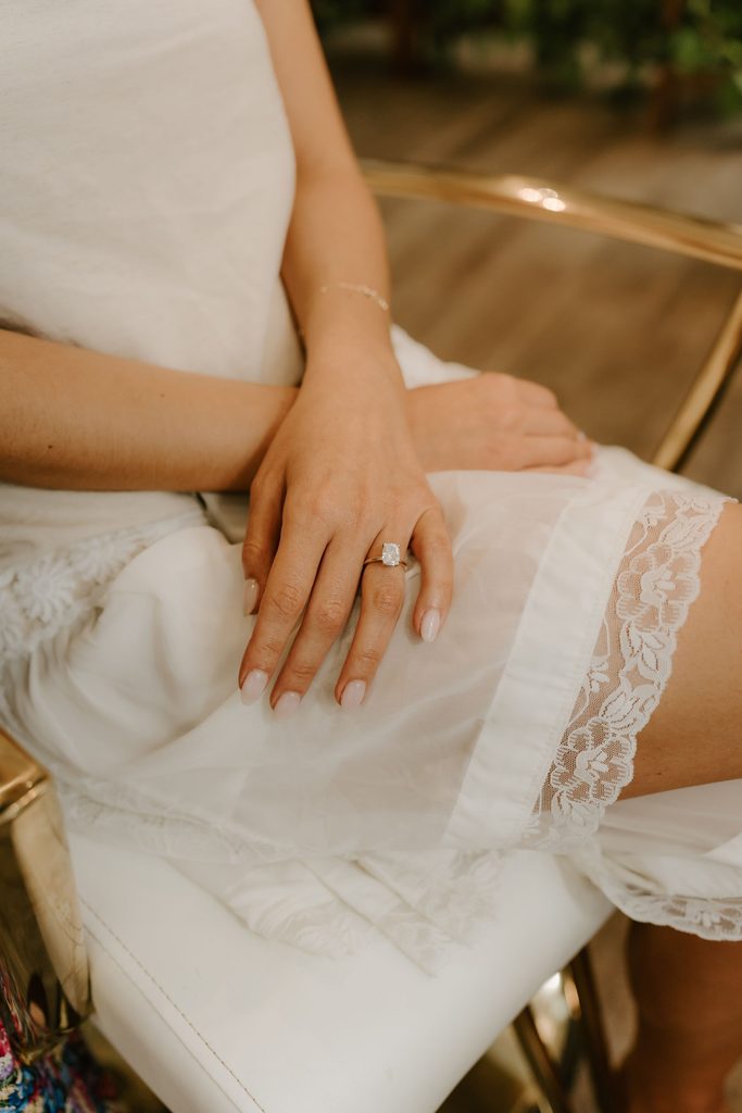Close-up of Lily's wedding ring and dress before the ceremony