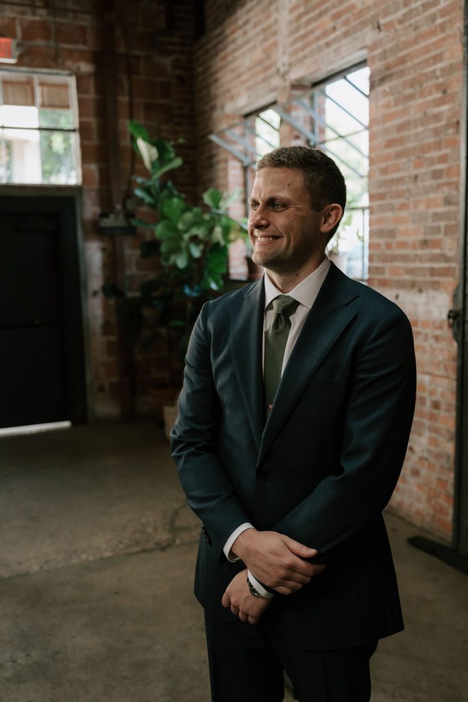 Ryan waiting at the altar during the wedding ceremony
