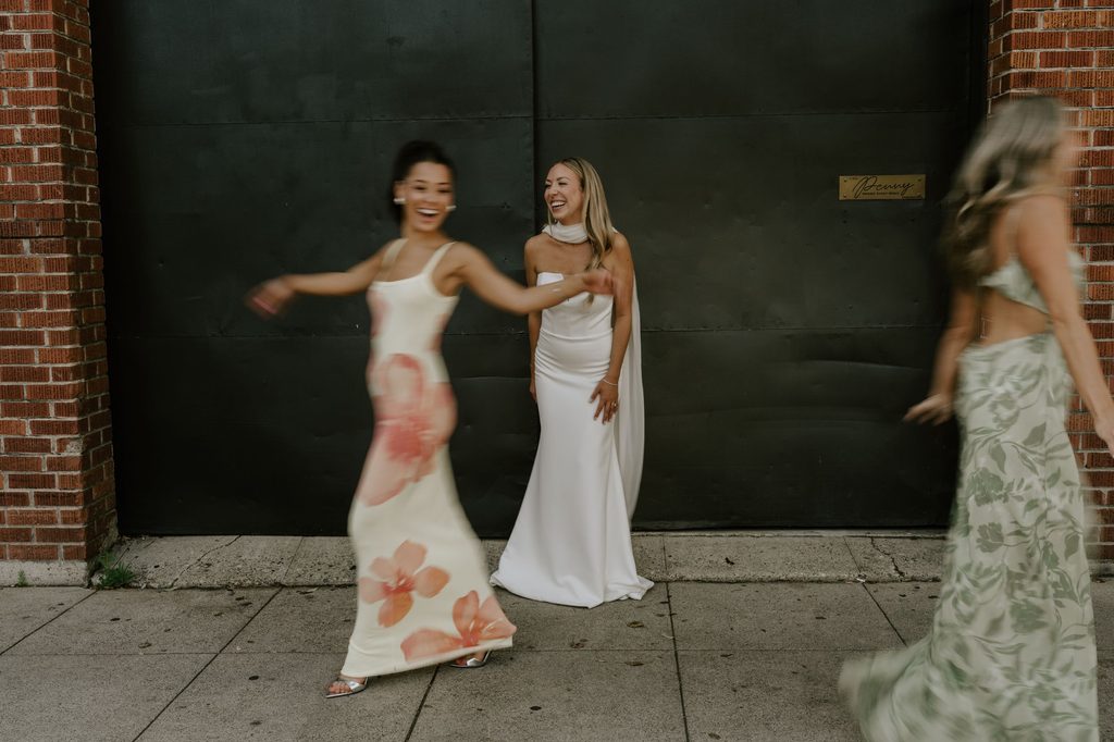 Lily greeting friends outside The Penny after the ceremony
