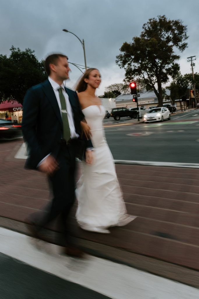 Lily and Ryan walking through downtown San Luis Obispo at dusk