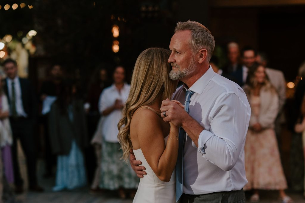 Lily dancing with her father during the wedding reception