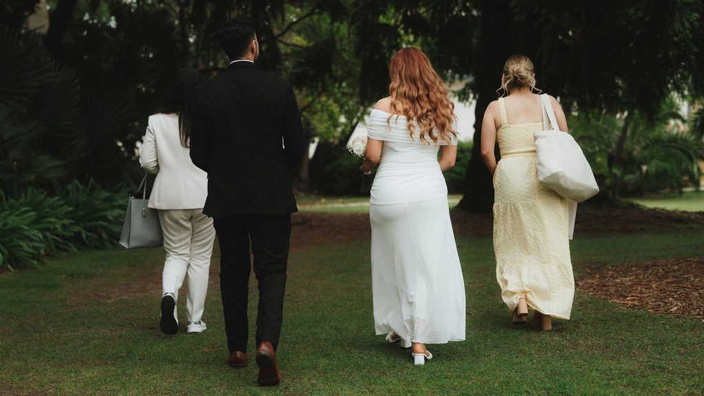 Vanessa and Bryant walking to their Santa Barbara Courthouse ceremony