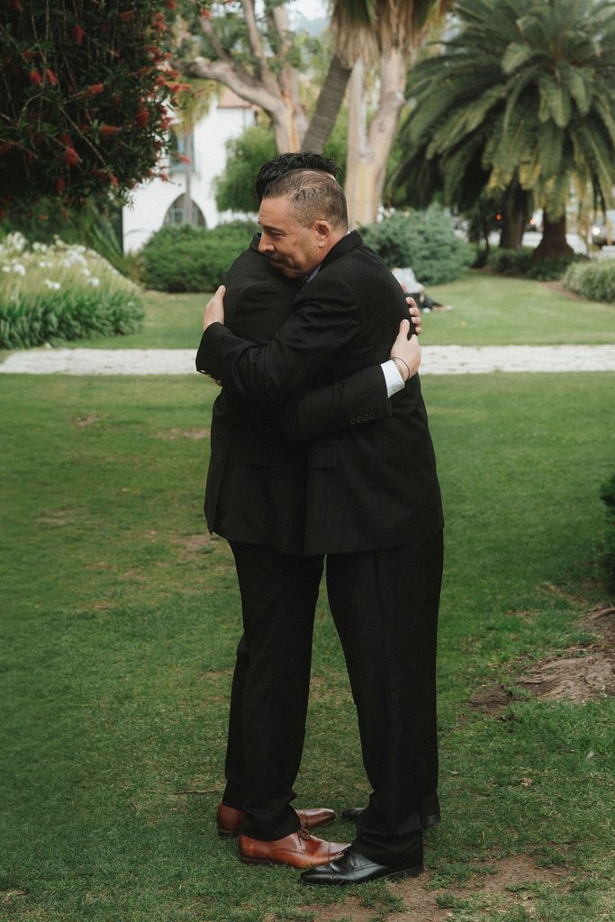 Vanessa and Bryant embracing on the courthouse lawn
