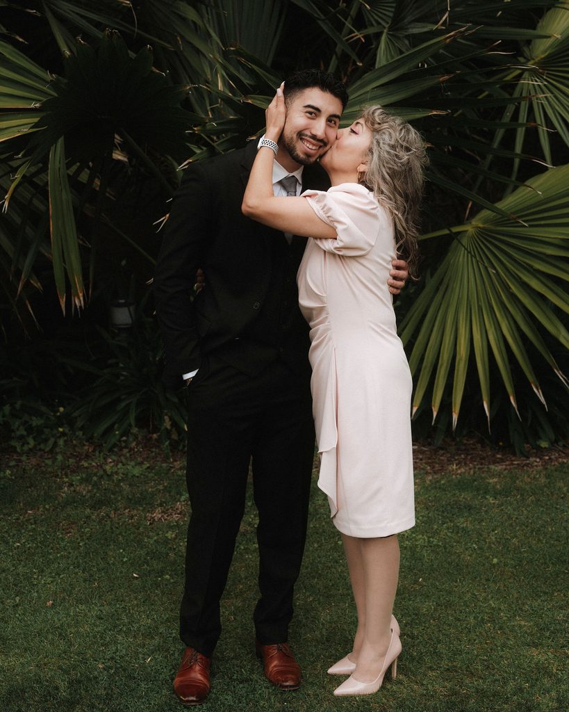 Bryant celebrating with a wedding guest after the ceremony