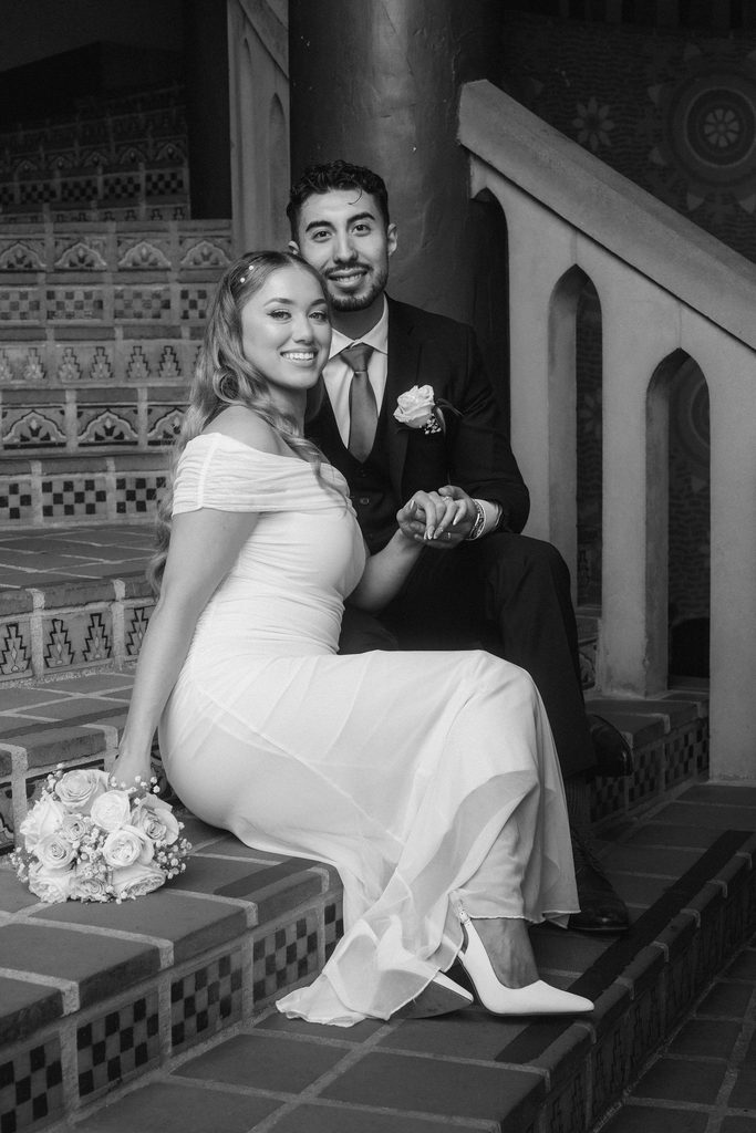 Black-and-white portrait of Vanessa and Bryant on courthouse tile stairs