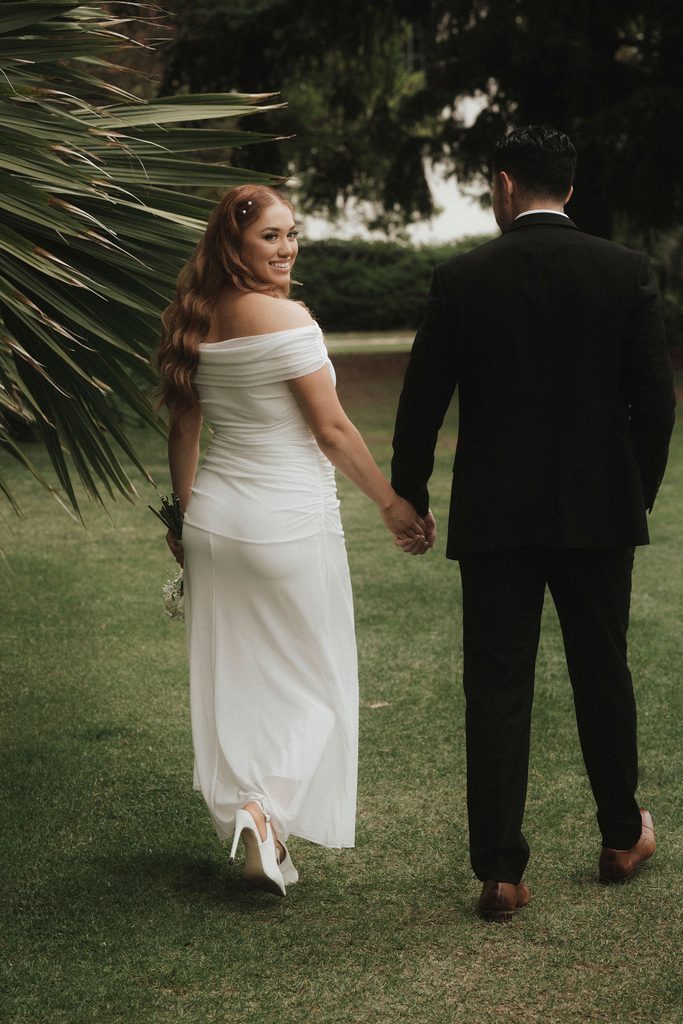 Vanessa and Bryant walking away together across the courthouse lawn