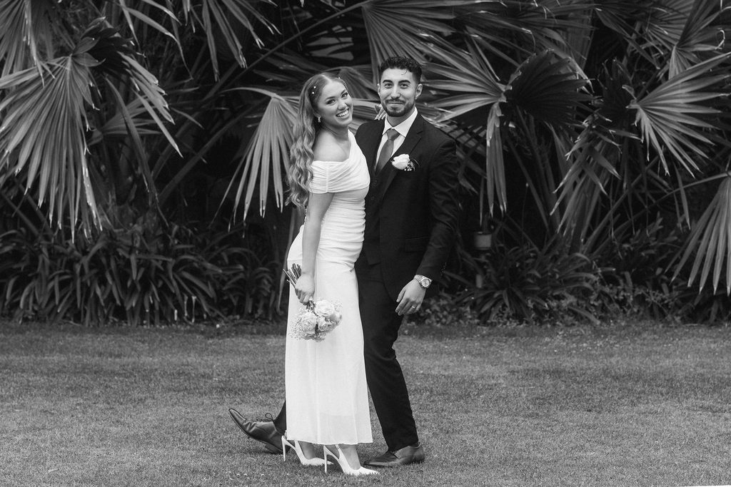 Black-and-white wedding portrait of Vanessa and Bryant in the courthouse garden