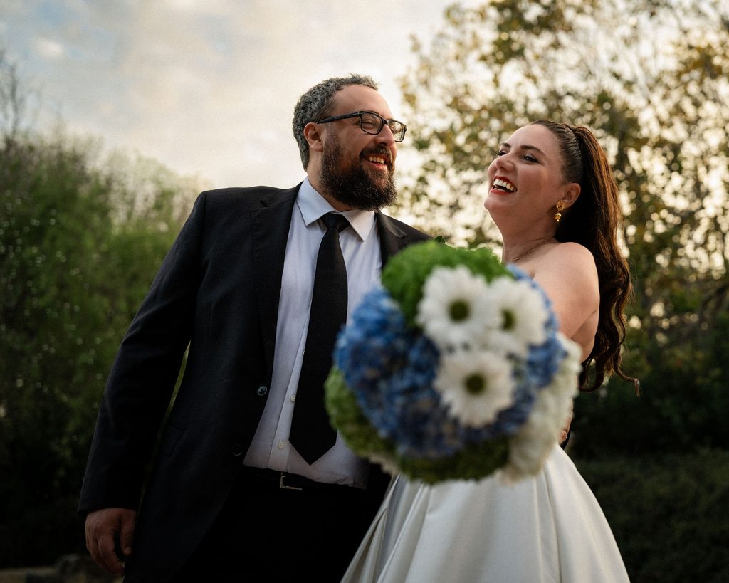 Catie and Tracy laughing together during wedding portraits