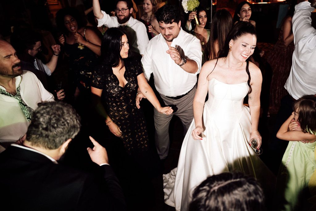 Catie dancing with guests at the Madonna Inn wedding reception